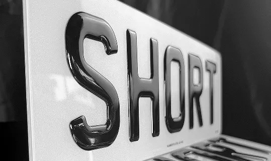 Road legal short number plates with reduced width for sports cars and shortened registrations